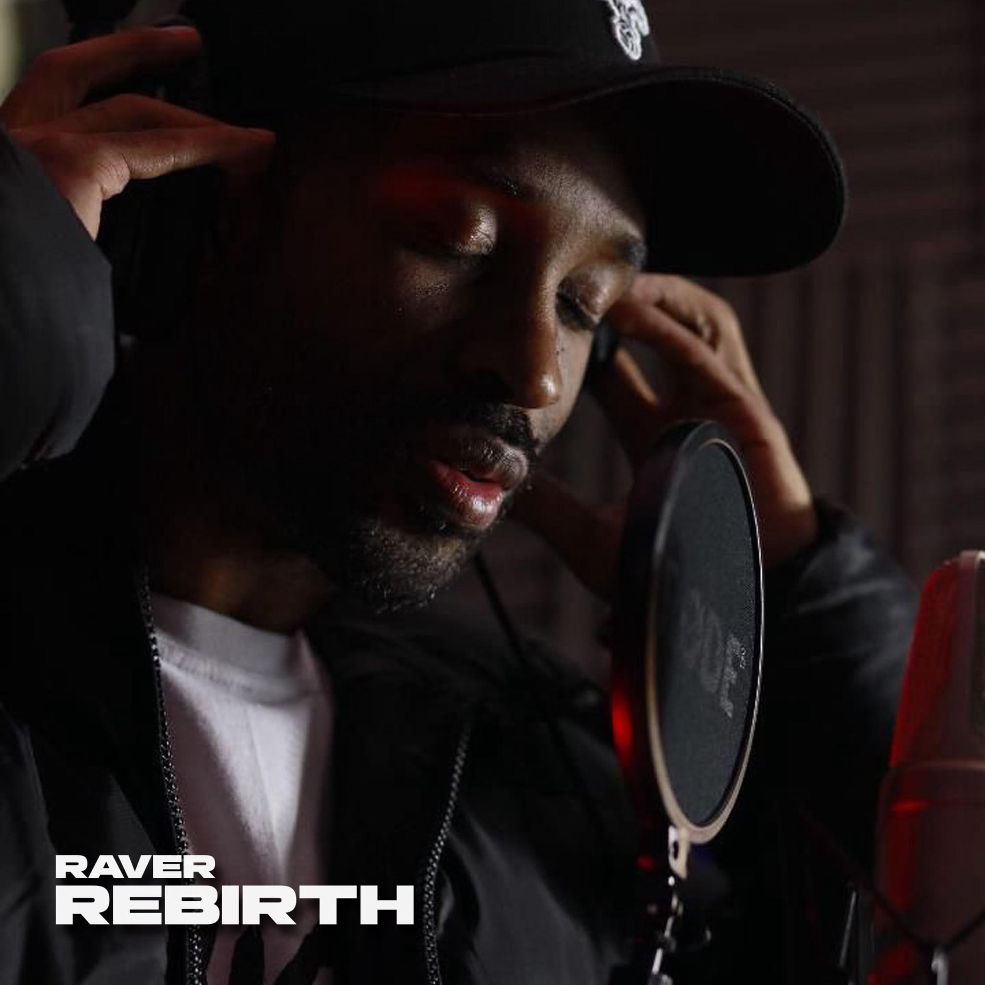 Raver recording vocals in the studio for his single Rebirth